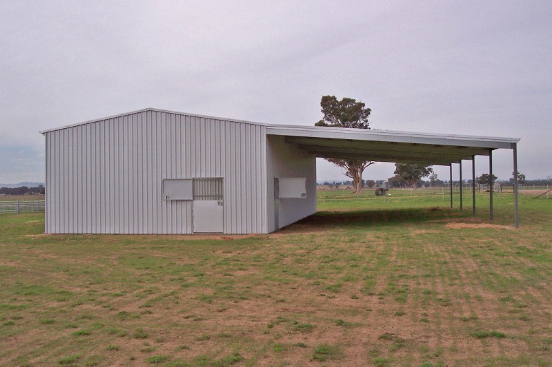 Enclosed horse stable shed with awning
