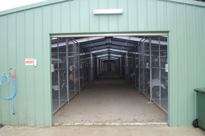 Golf buggy storage shed roller door open