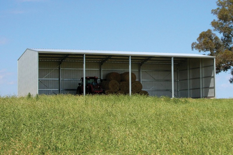 Open front farm shed with four bays