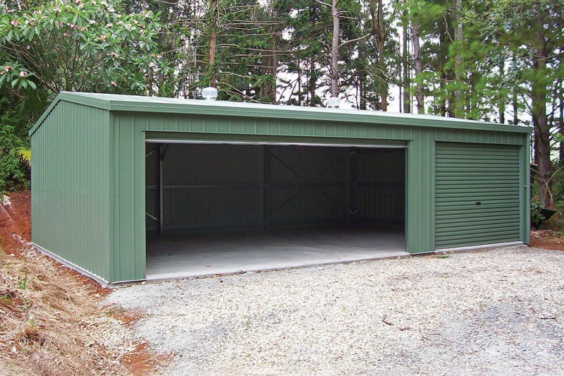 Triple garage with one large and one small roller door